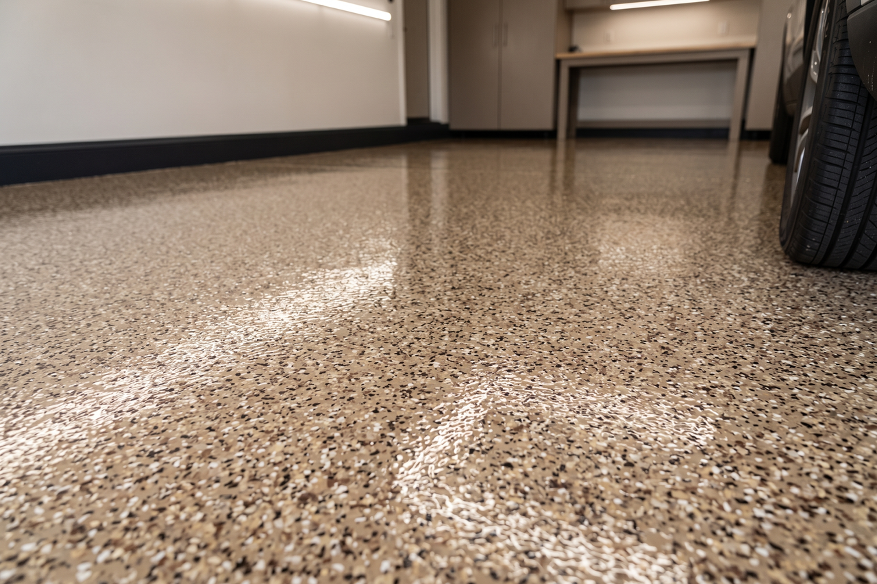 Coated garage floor showing a seamless, reflective surface in excellent condition